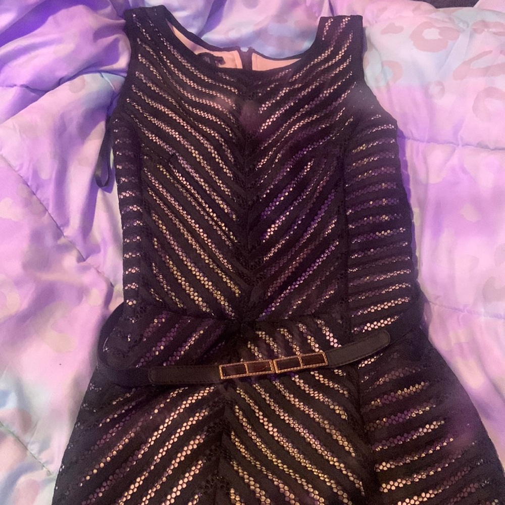 Black and cream colored dress with belt